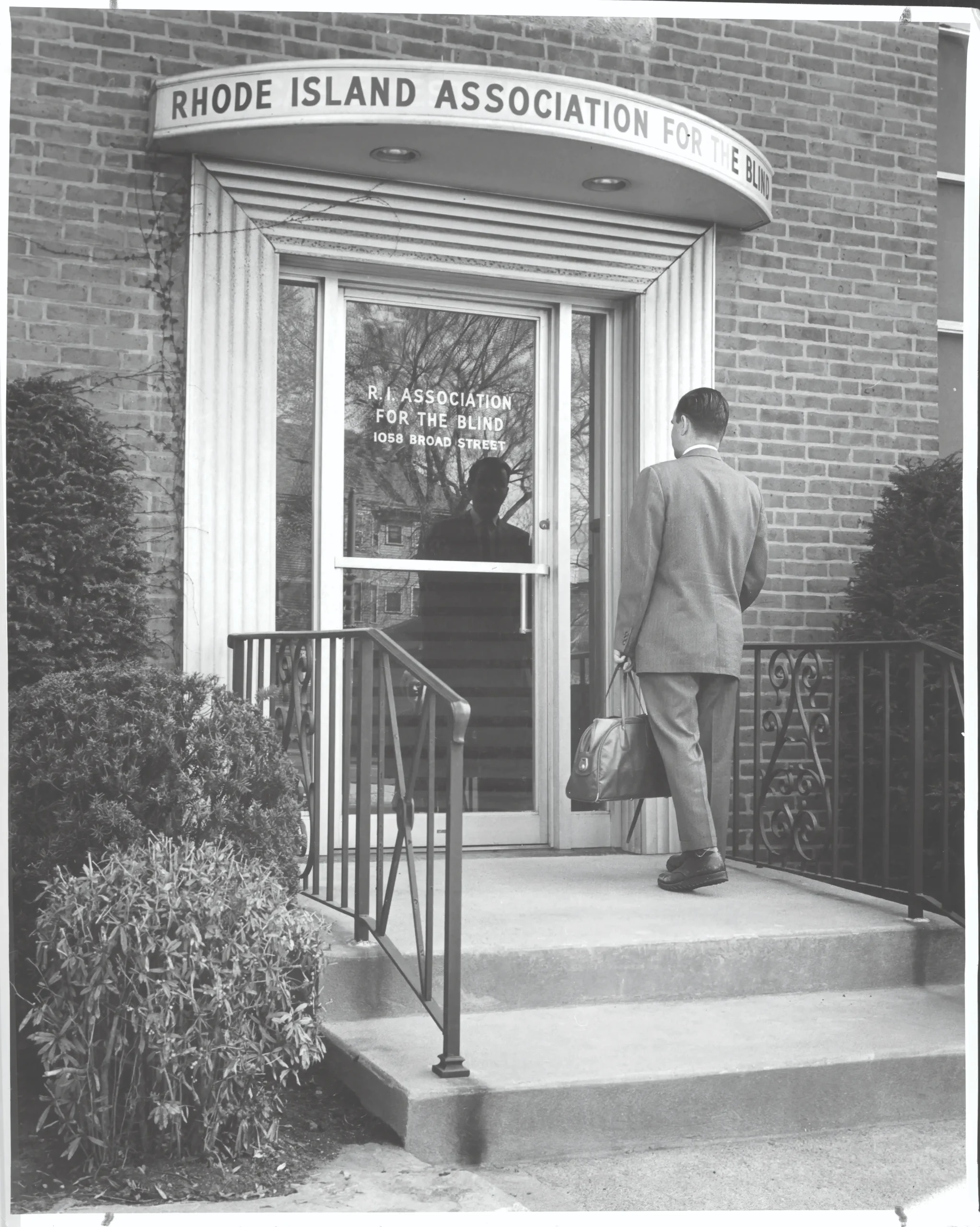 A man walks into the front door of the Rhode Island Association for the Blind.