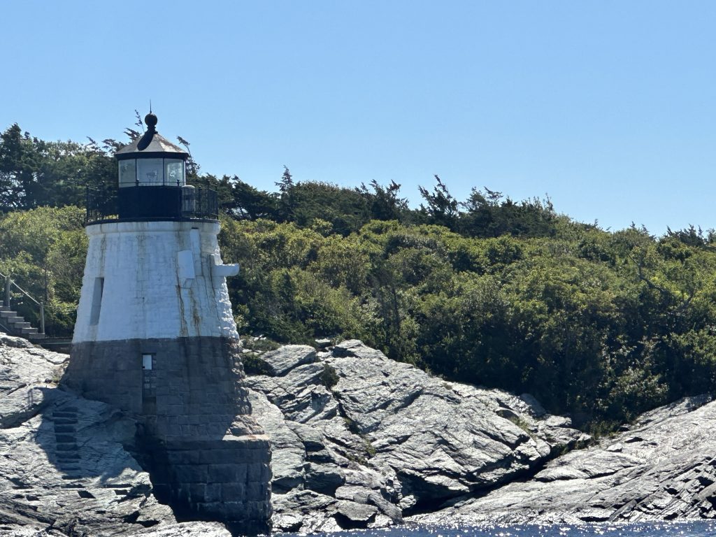 IMG_6975 - IN-SIGHT A lighthouse sitting atop a rocky cliff